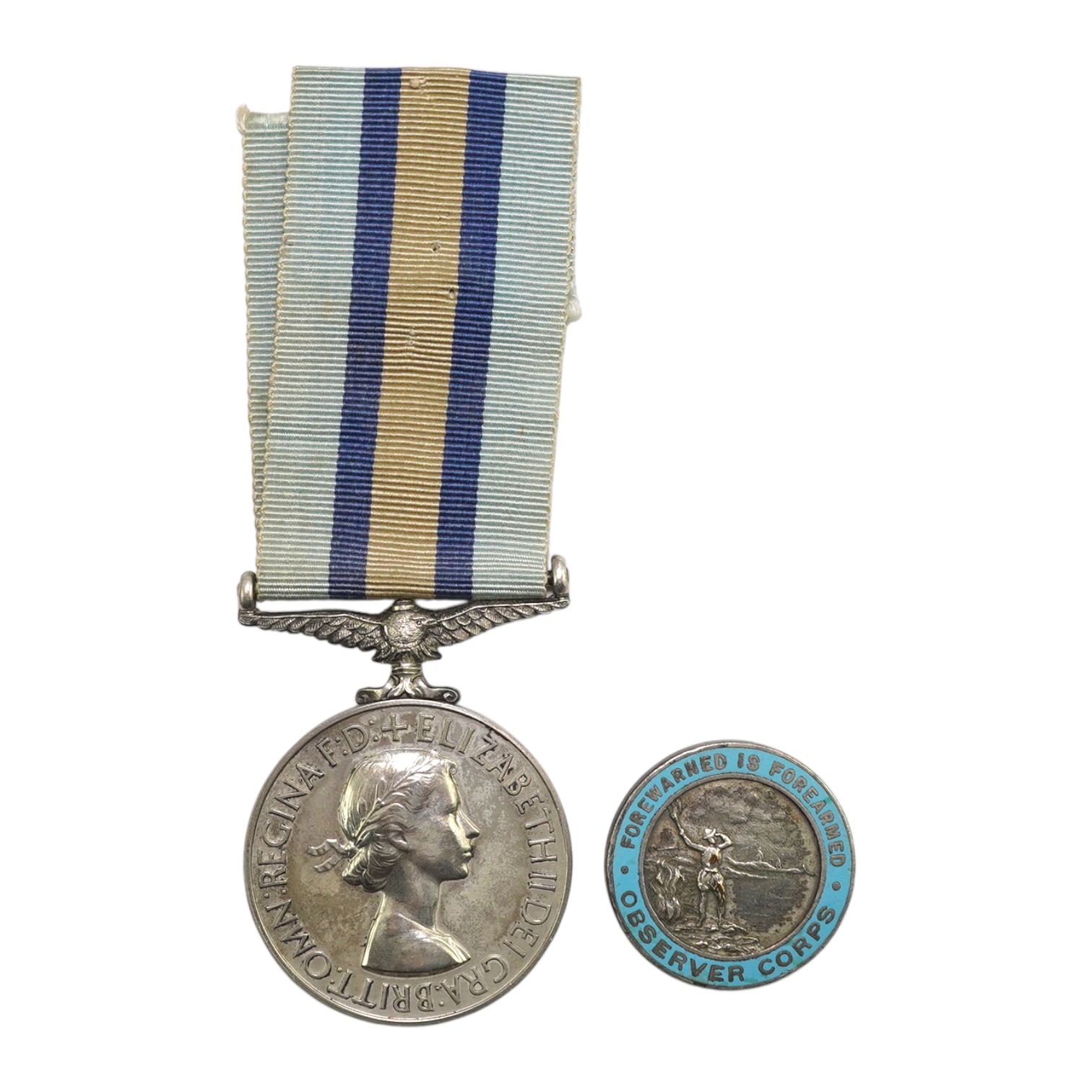 An ERII (B) Royal Observer Corps medal to Observer W.Cook with a lapel badge. Condition - fair.